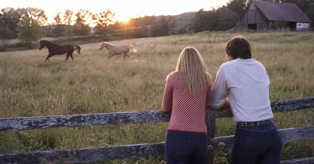 13 Classic Rock Ballads That Instantly Take You Back 6 Young couple watching horses across a pasture in the early 1970s