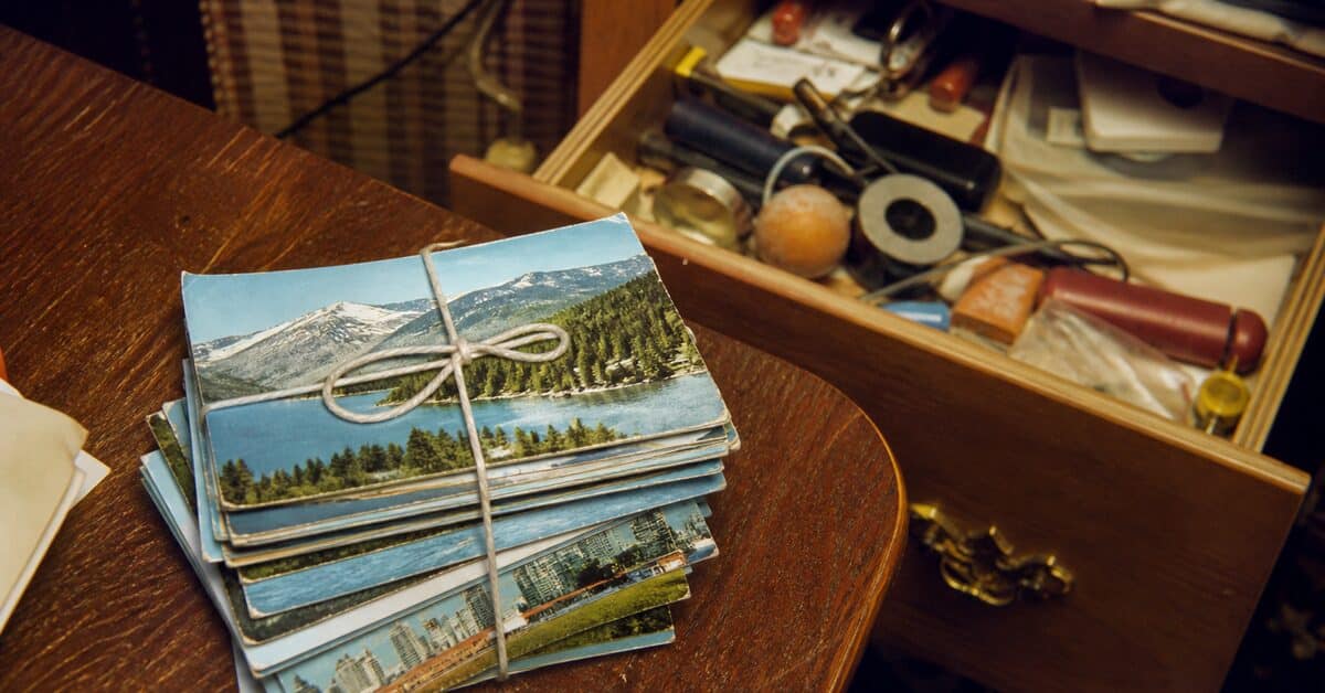 15 Items in Your Junk Drawer That Could Be Worth Real Money 8 Stack of vintage scenic postcards found in a junk drawer