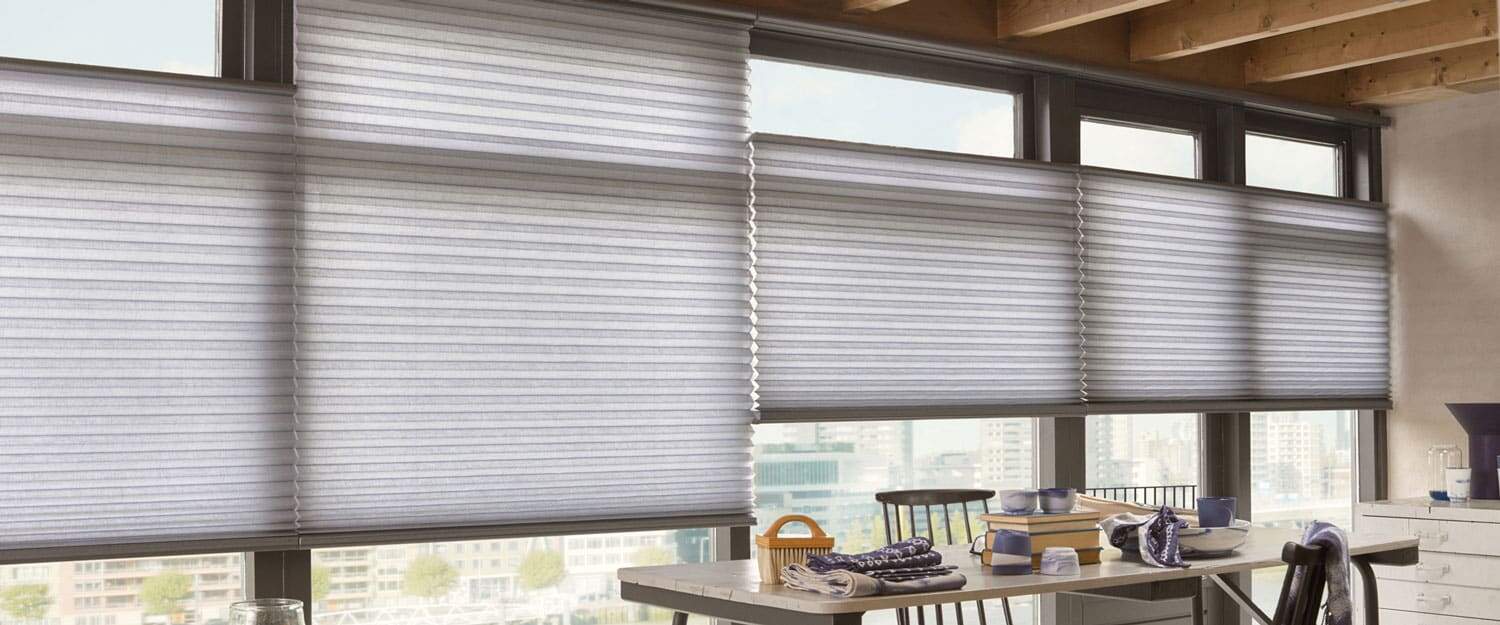 Bright office space with modern window blinds.