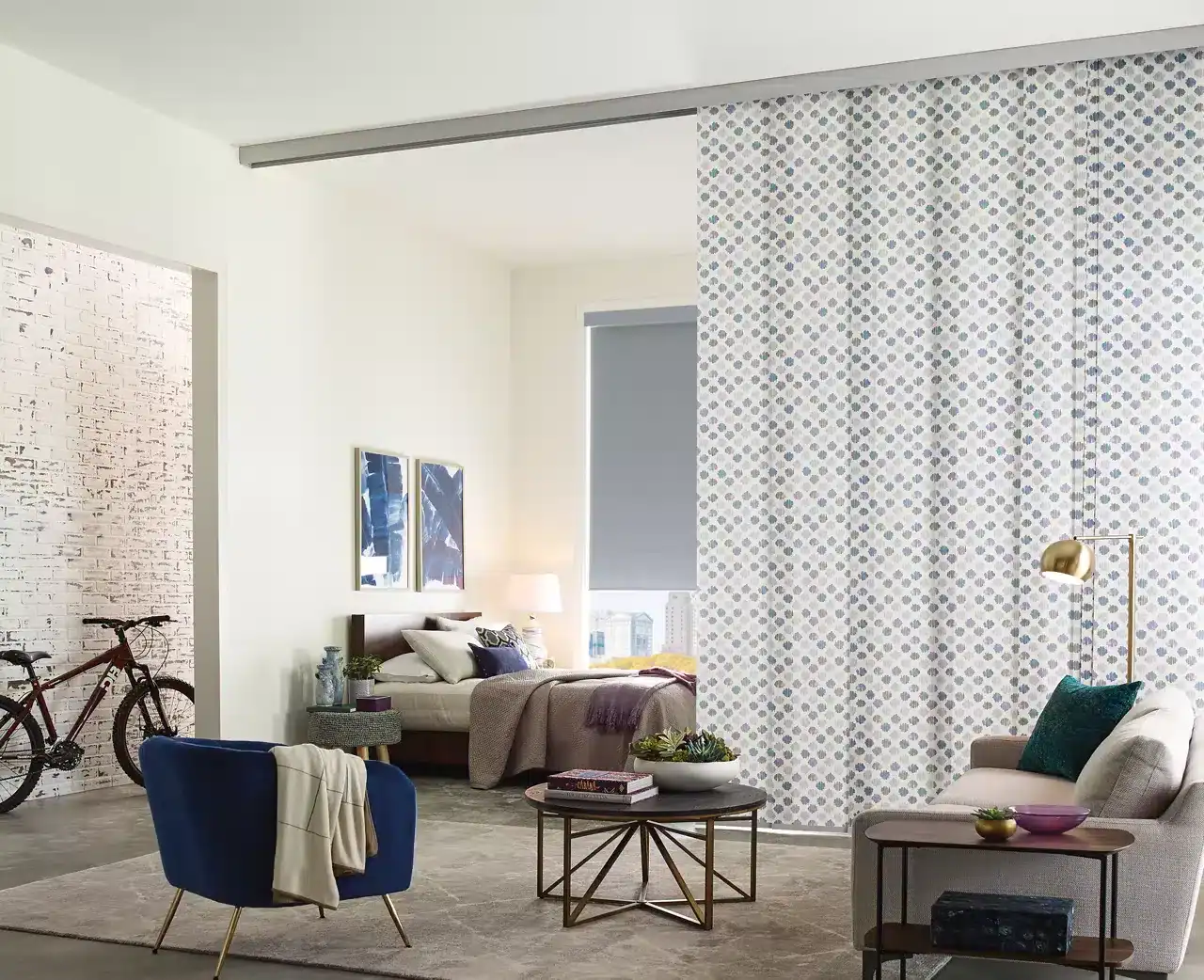 Bright and stylish living room with cozy seating, contemporary decor, and a decorative partition wall for a chic home design.