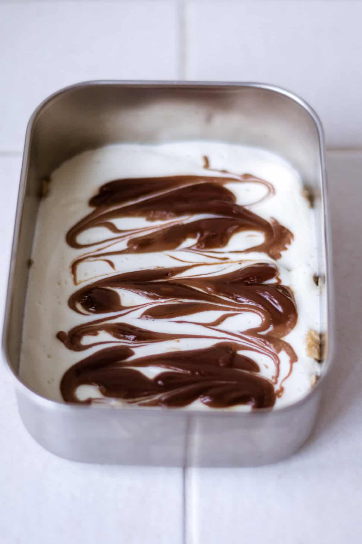 Overhead shot of nutella overnight weetabix in a meal prep container.