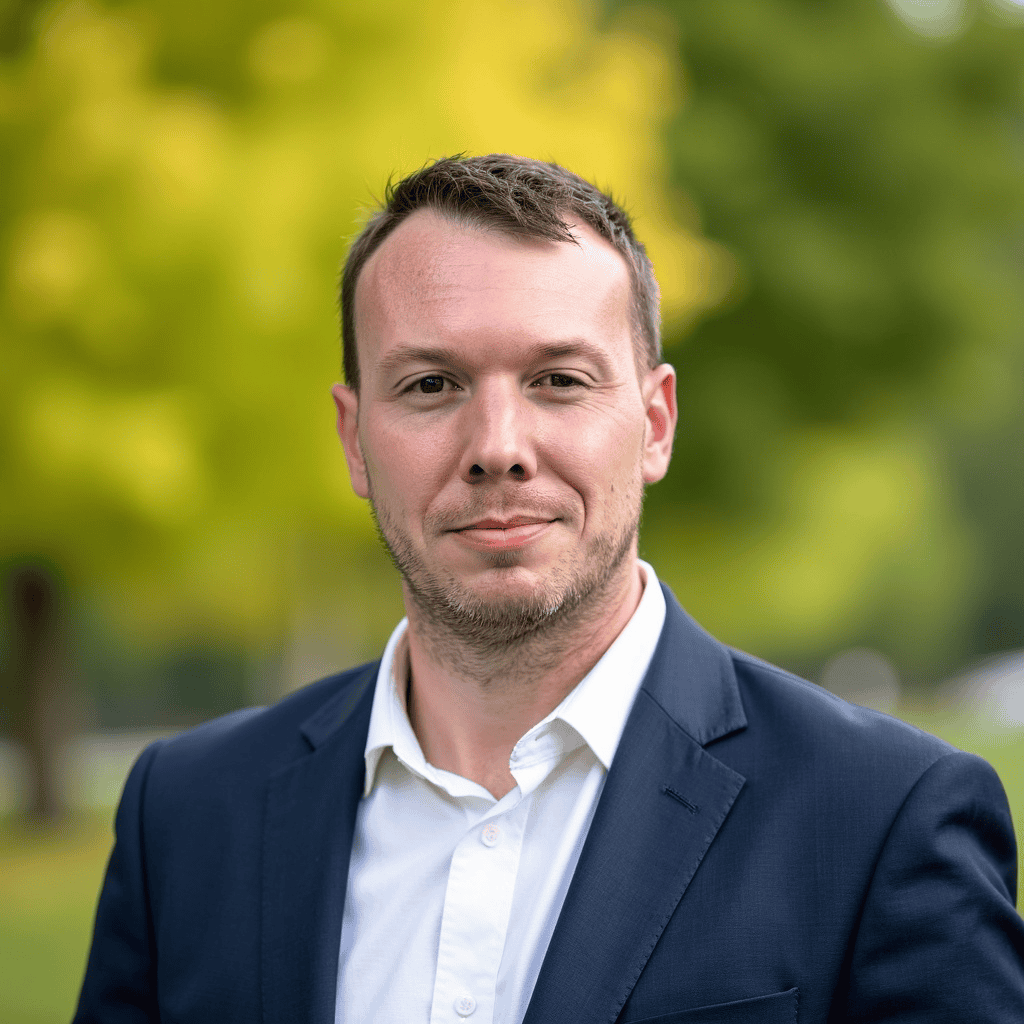 Professional man in business suit outdoor, representing workplace management and scheduling solutions.