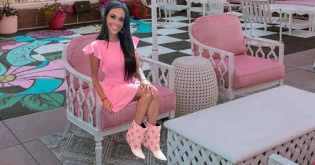 girl sitting on chair in Dolly Partons White Limozeen in Nashville