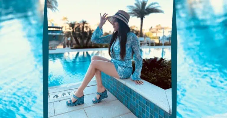 Skylar Porter sitting on ledge by pool wearing Luxury Women's Shoes in Palm Beach