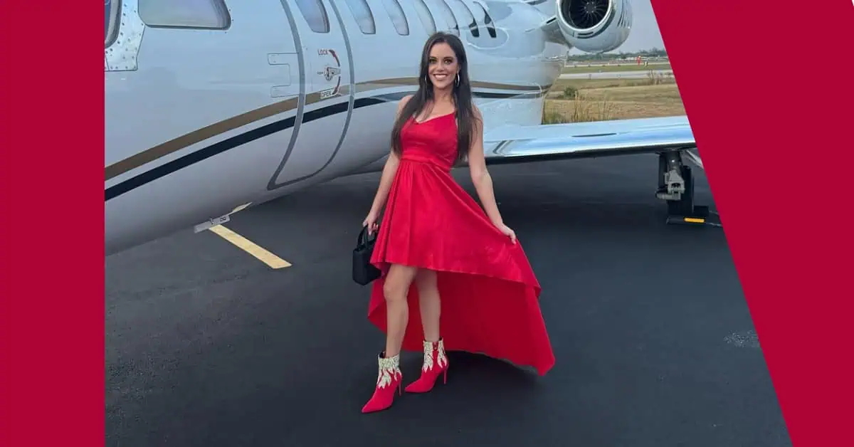 Skylar Porter by plane in Boca Raton wearing SkyStruk womens red heel shoes