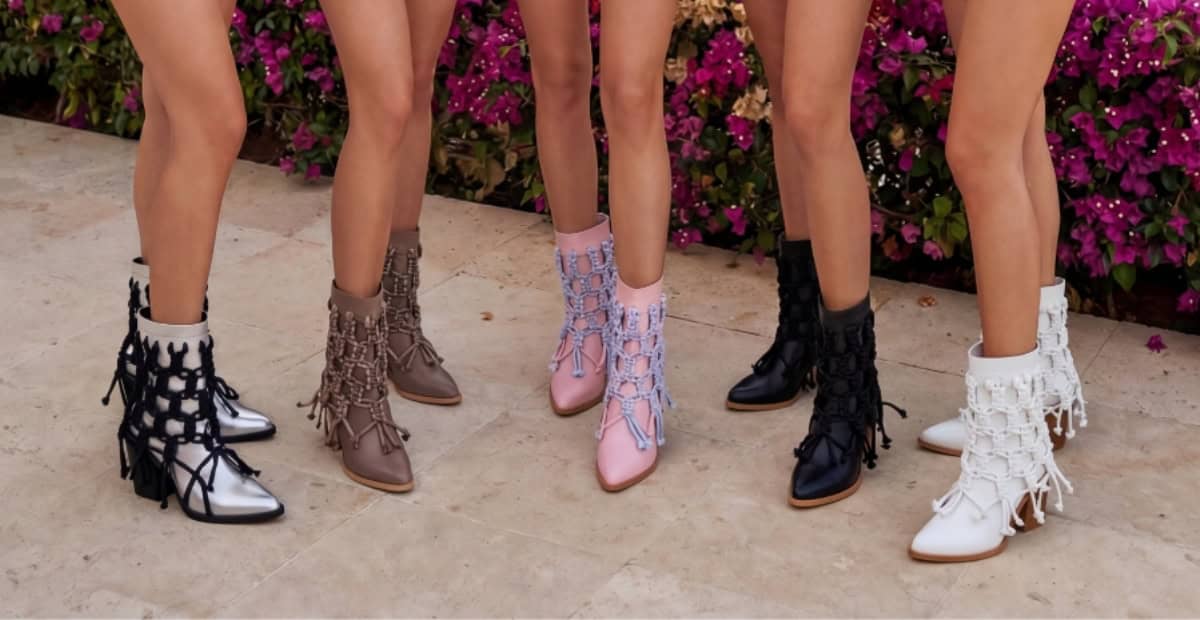 legs of 5 women wearing ankle boots, guide how to style booties in 2026