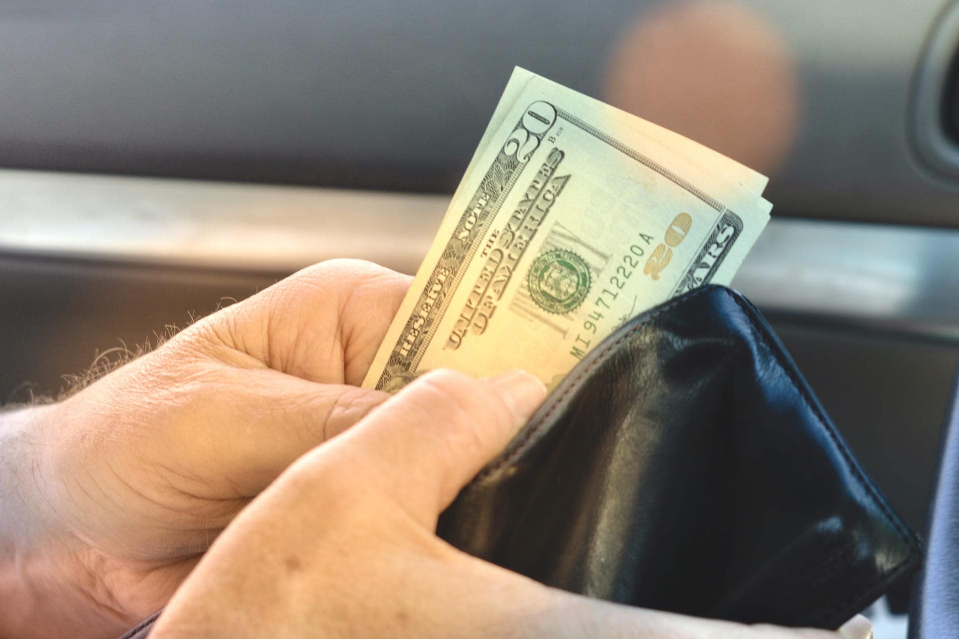 paying a car detailer