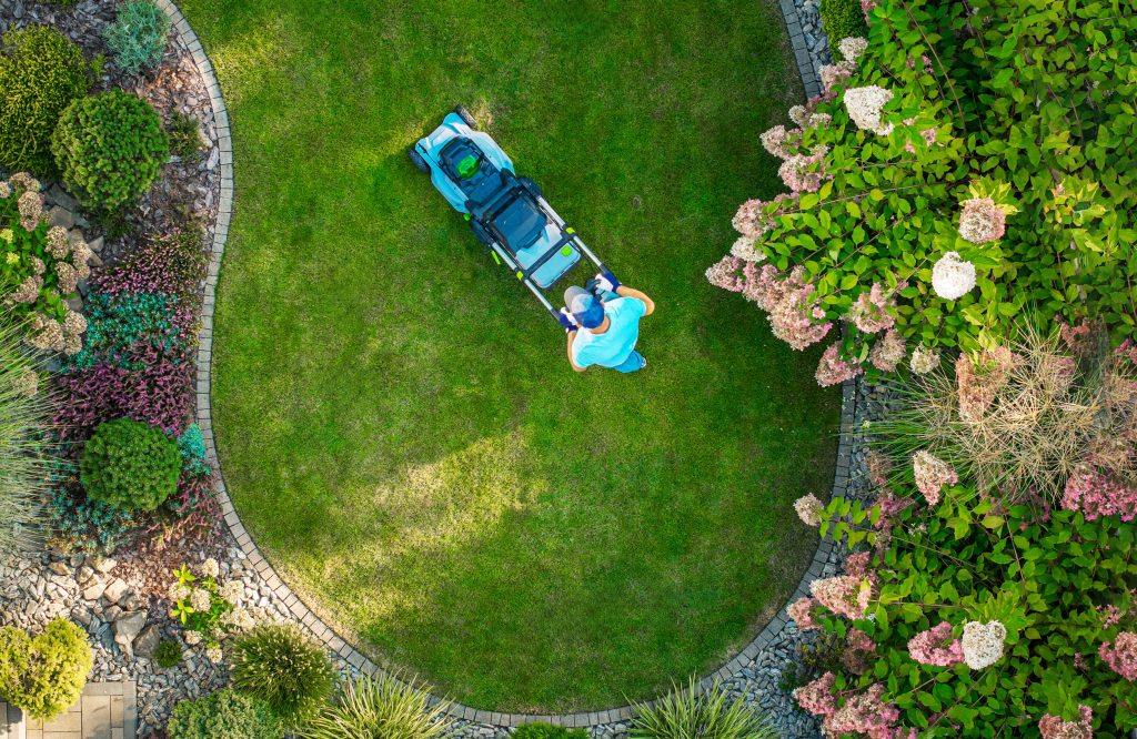 Landscaper cutting grass