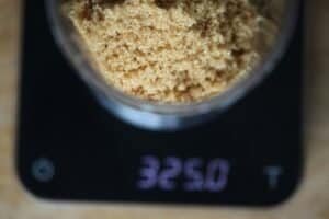 some brown sugar being prepared and weighed in kitchen