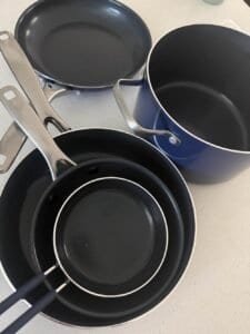 cookware set on countertop in kitchen
