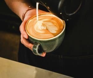 a milk froth pour over fresh coffee