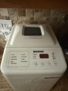 a used bread machine on counter