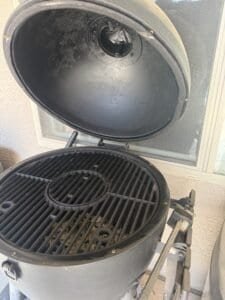 a kamado grill on a patio in the desert