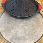 Best Pizza Pans and Crisper Trays in 2026: Perforated, Solid, and Stone Picks