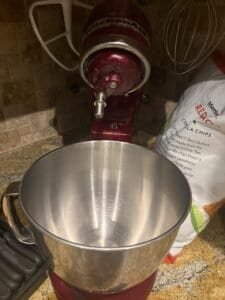 a tilted back stand mixer showing the bowl in full