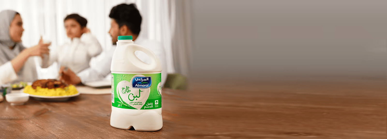 A family enjoying dinner with Almarai laban - (Credits Almarai)