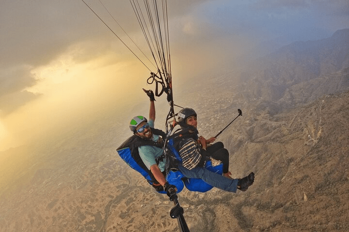 Experience the thrill of paragliding this Eid al-Adha in Saudi Arabia. Feel the rush and fly like an eagle. – (Credits: TripAdvisor)