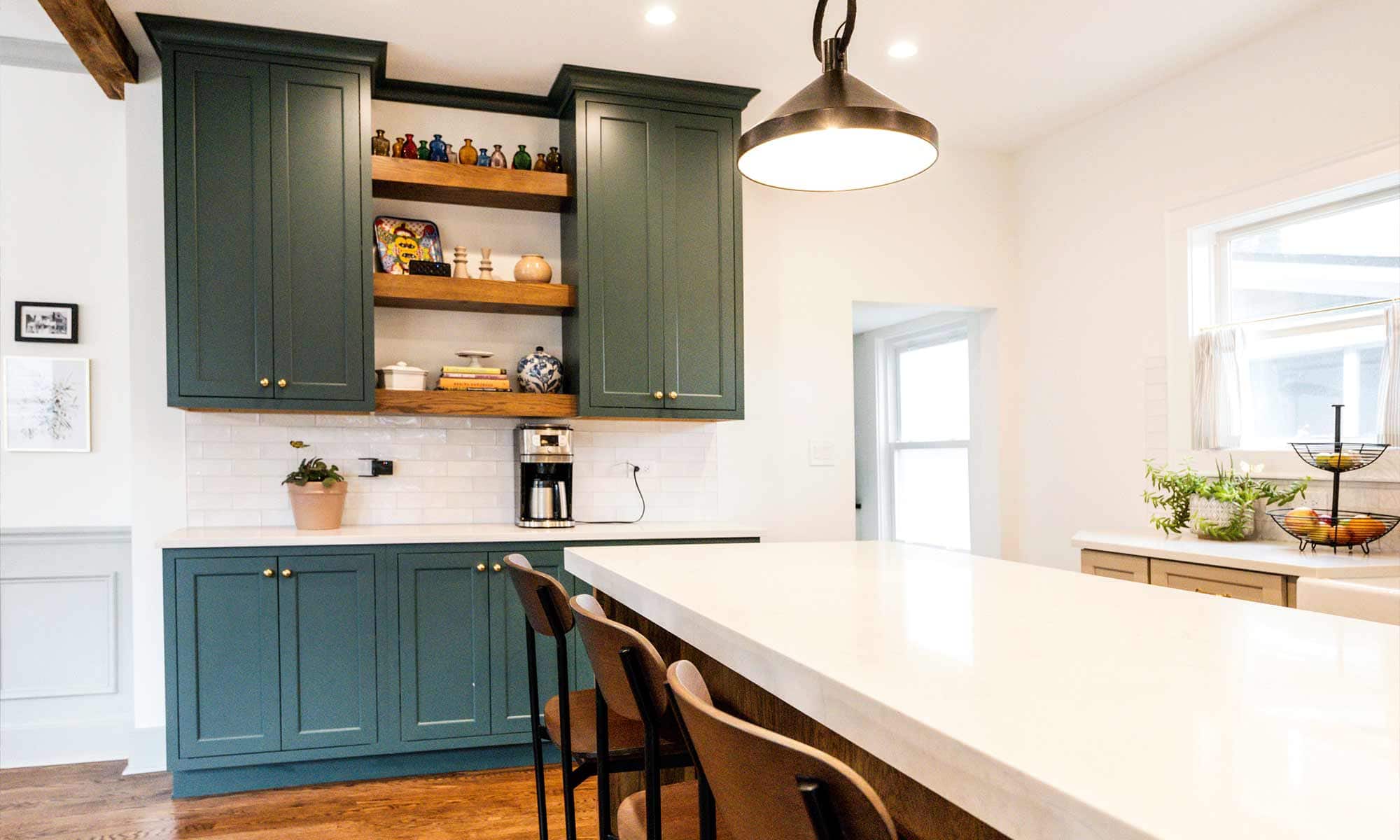 dark wood kitchen island with blue white and beige perimeter cabinetry in la grange park Illinois vintage kitchen remodel