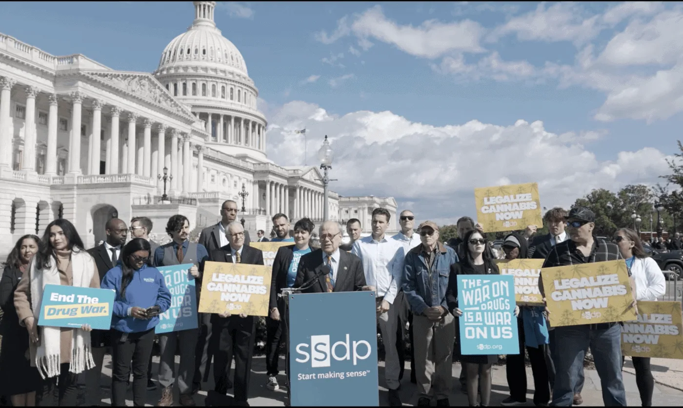 Protesters advocating for drug policy reform outside the U.S. Capitol building.