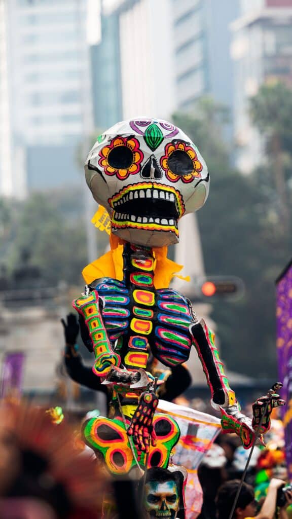 Day of the Dead Parade during FIFA World Cup 2026 in Mexico City featuring football-themed floats, alebrijes, and cultural performances on Paseo de la Reforma