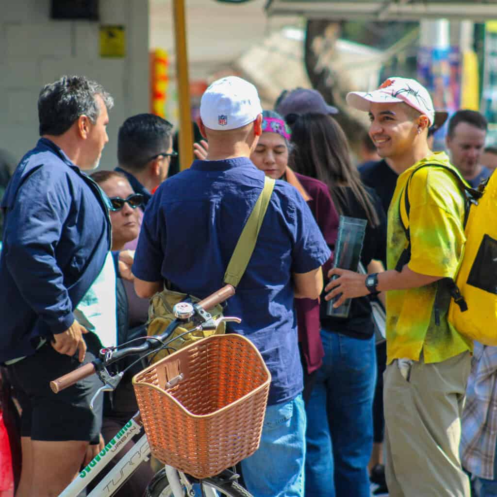 Group of travelers tasting quesadillas at a Condesa food stand.