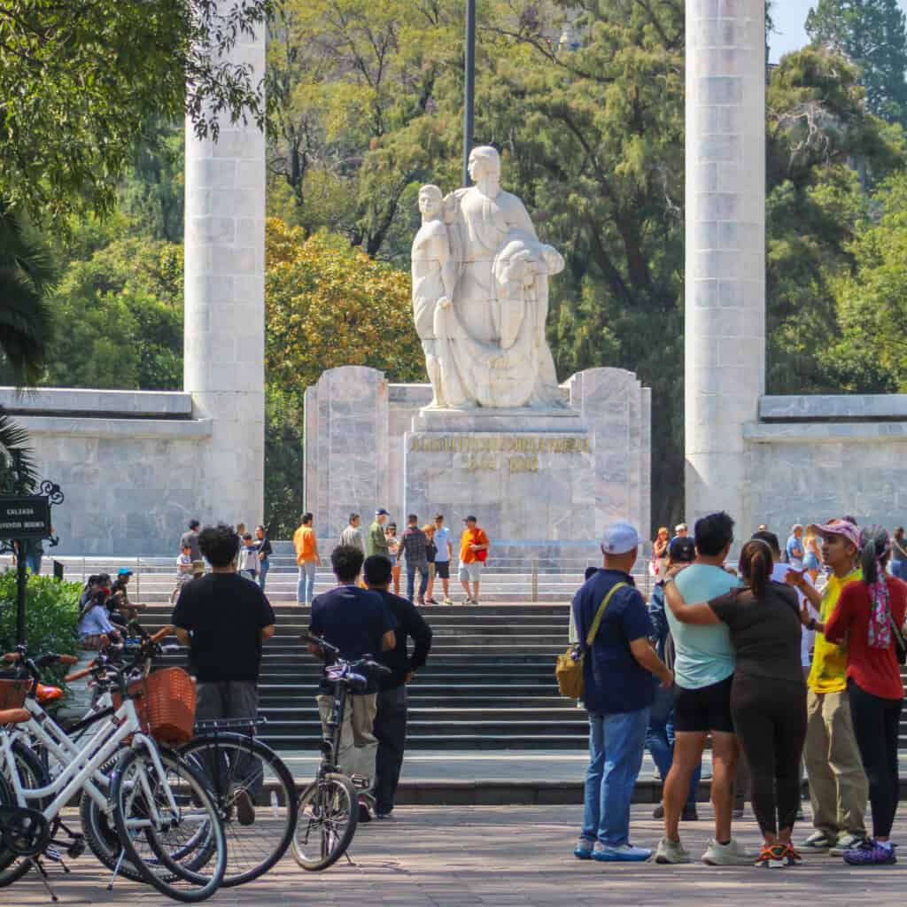 Cyclists riding through quiet paths in Chapultepec with Food Hood Tours.
