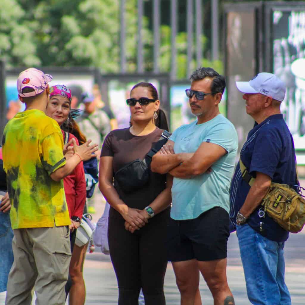 Guide explaining Mexico City’s bike culture to Food Hood Tours guests.