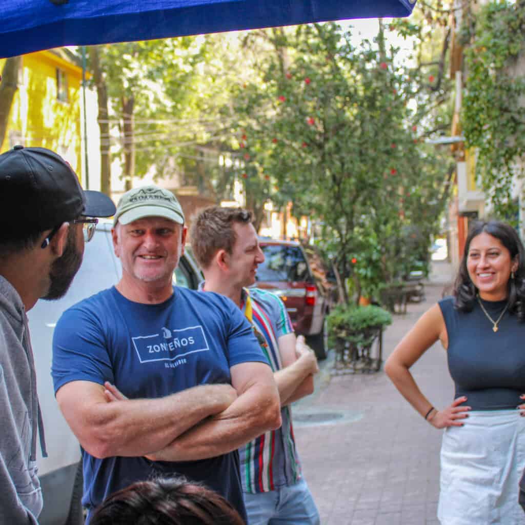 Food Hood Tours guests enjoying fresh seasonal fruit during the Mexico City bike experience.