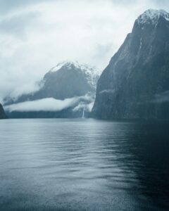Majestic mountains and waterfalls in Milford Sound, New Zealand.