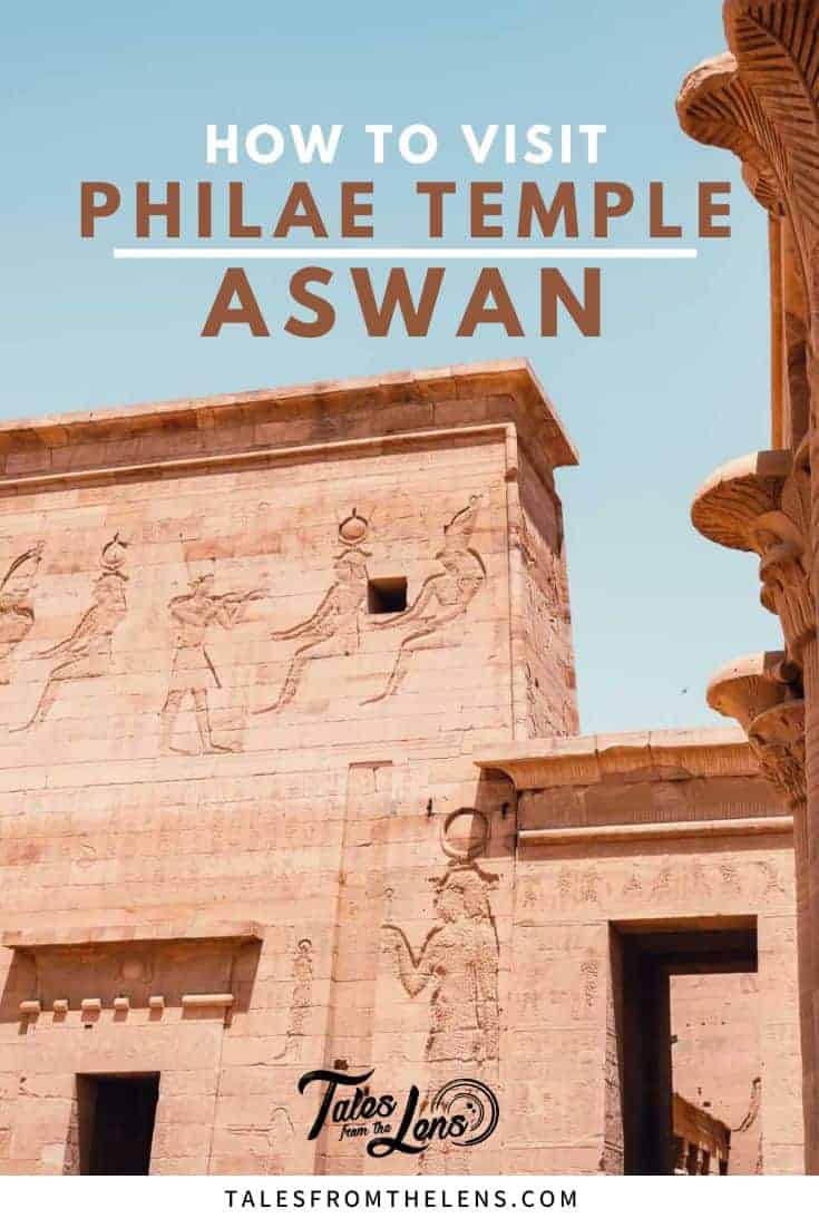 Pinterest graphic titled "How to Visit Philae Temple Aswan" over a photo of Philae Temple’s stone carvings in Egypt, showing ancient deities etched into the sandstone facade. The corner features ornate lotus-style columns and the blog name Tales from the Lens.