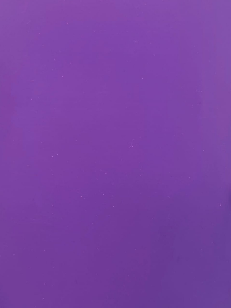 Solid purple background with a subtle texture and a few small white specks
