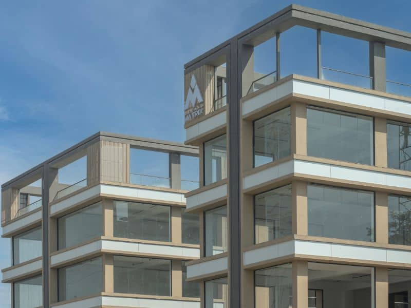 Akshar Matrix Ahmedabad  modern façade in AluWall Pastel White ACP AW509