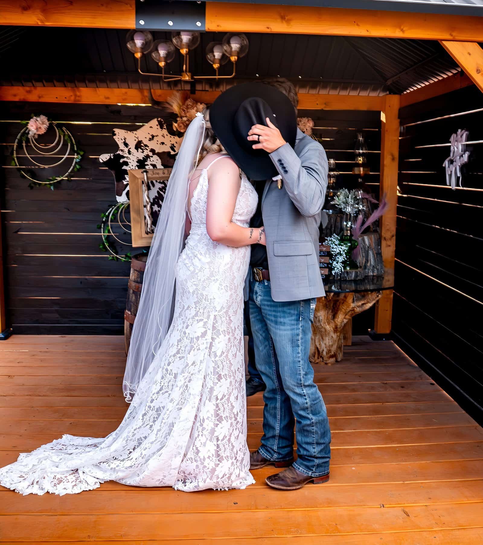 Romantic wedding moment captured outdoors with rustic decor and intimate atmosphere.