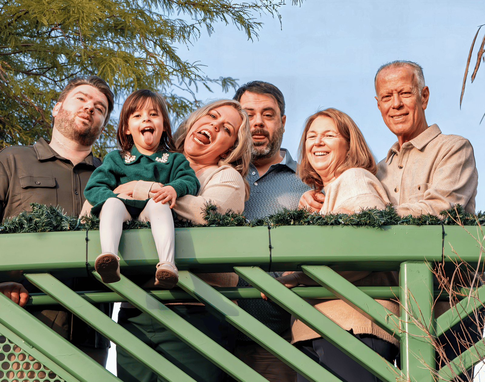 Joyful family gathering on a balcony, capturing a memorable moment.