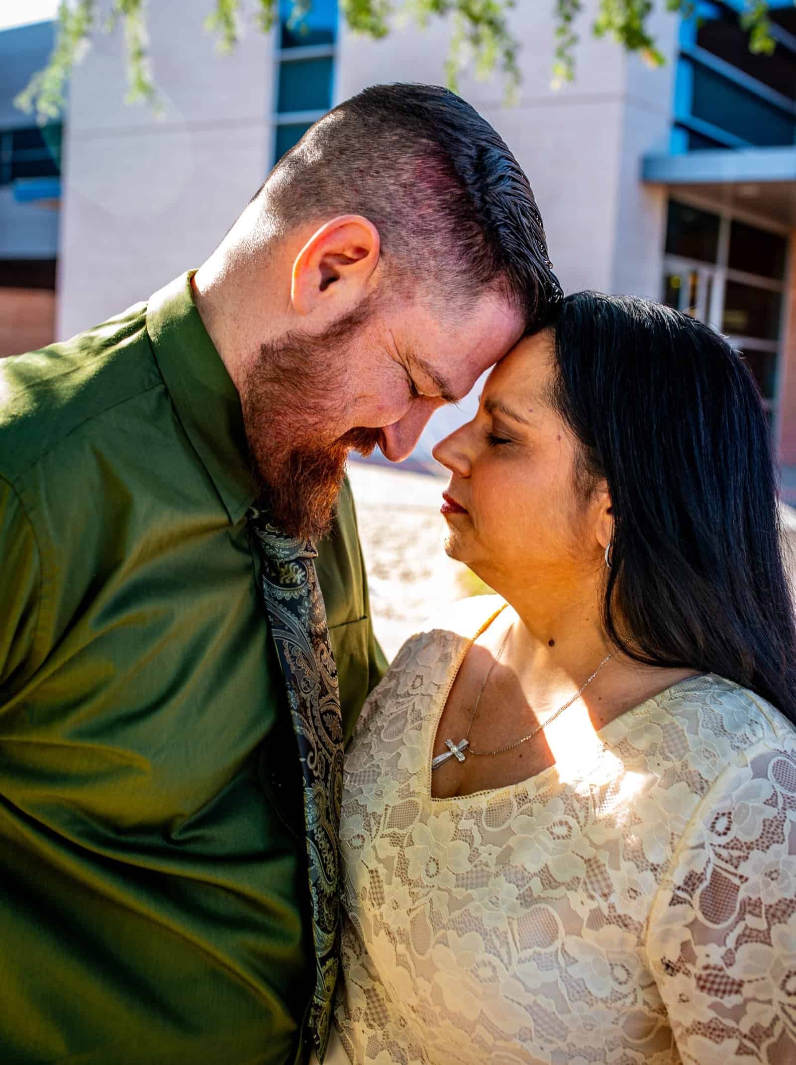 A touching scene of a man and woman sharing an intimate, emotional moment outside, highlighting love and togetherness.