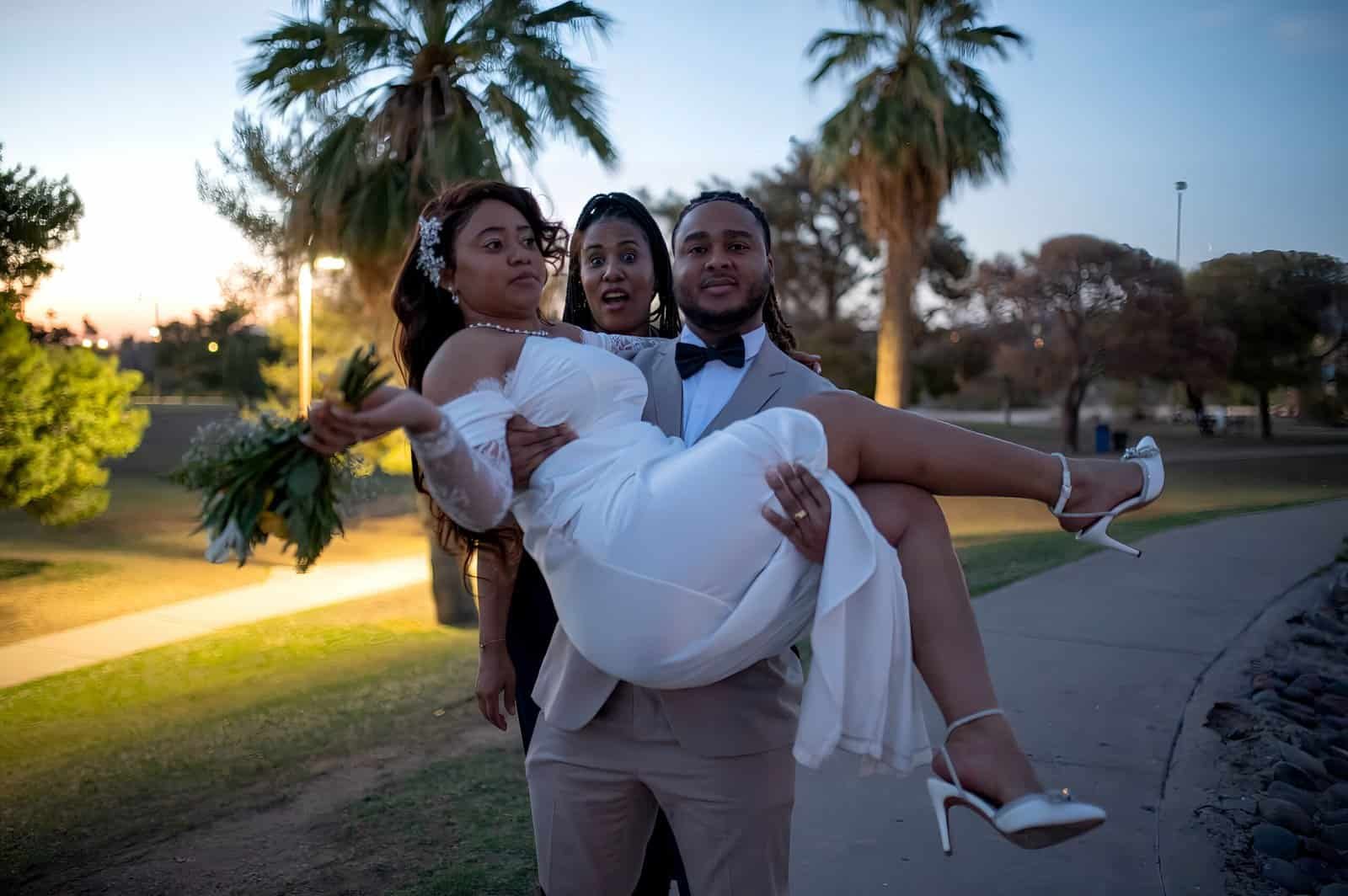A joyful bride and groom sharing a special moment in a park during sunset, capturing their love and happiness on their wedding day.