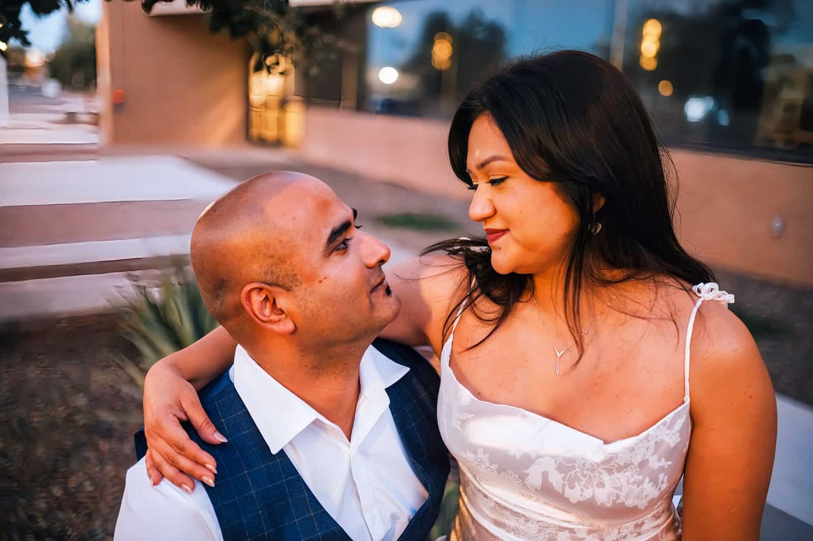 A couple sharing an intimate moment outdoors at sunset, capturing love and emotional connection for special memories.
