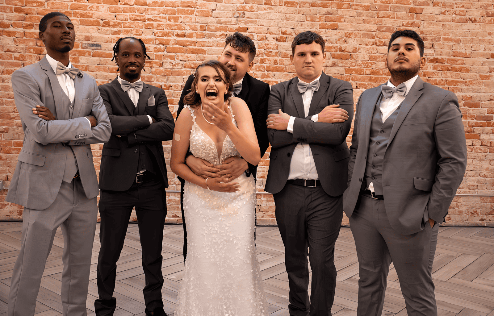 A joyful wedding celebration with the bride and groomsmen, captured by Special Moment Video.