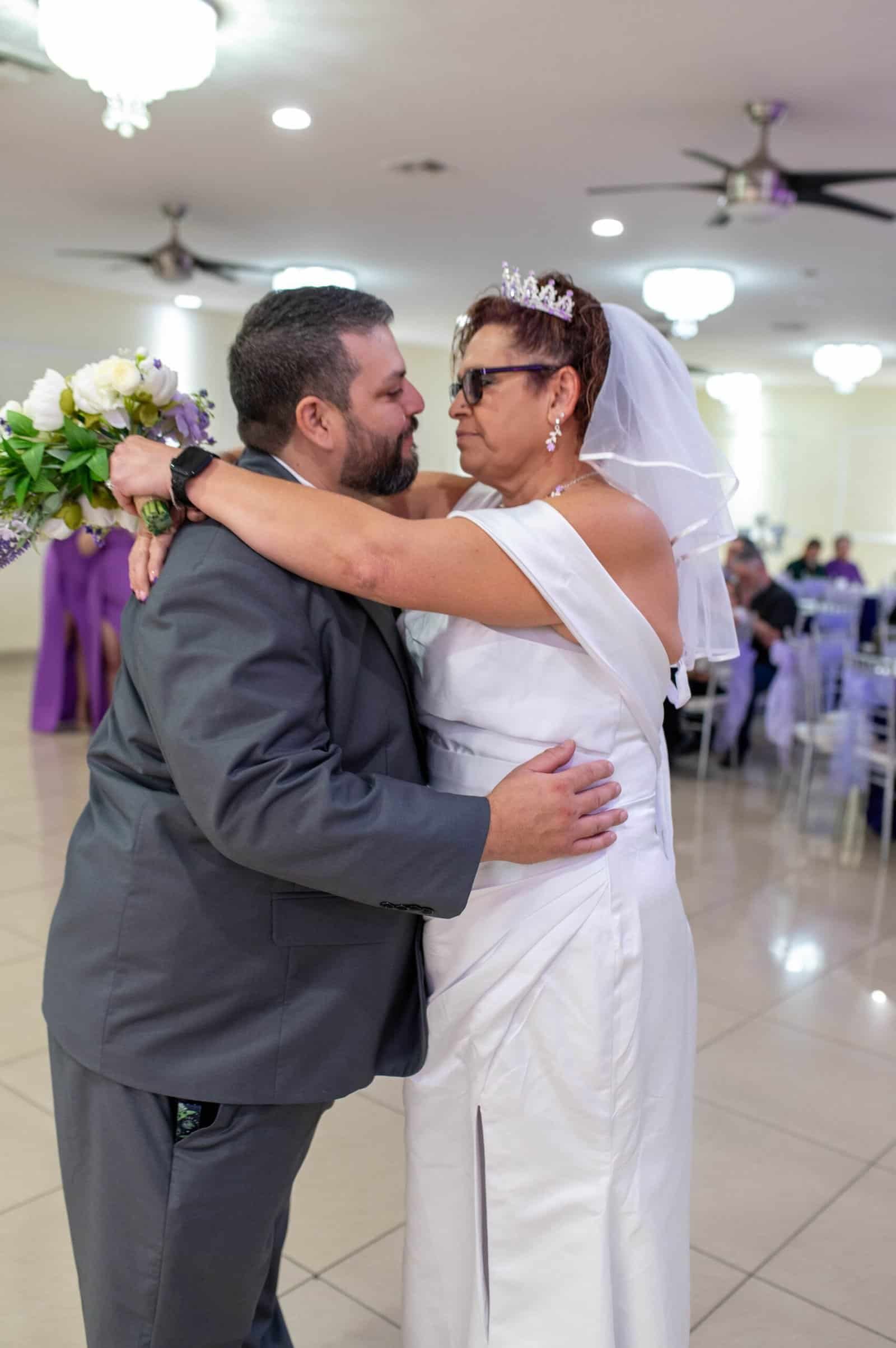 A touching mother-son dance at a wedding reception, highlighting love, joy, and special family moments in a beautifully decorated venue.