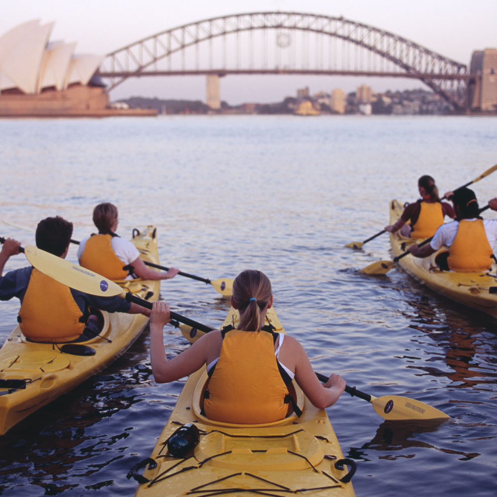 Private paddleboard tour on calm Sydney waters with Splendour Tailored Tours