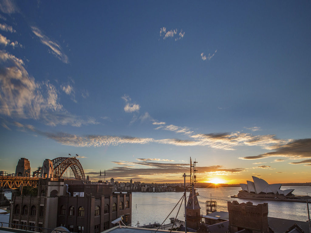 A stunning sunrise over the City on your Sydney Day Tour