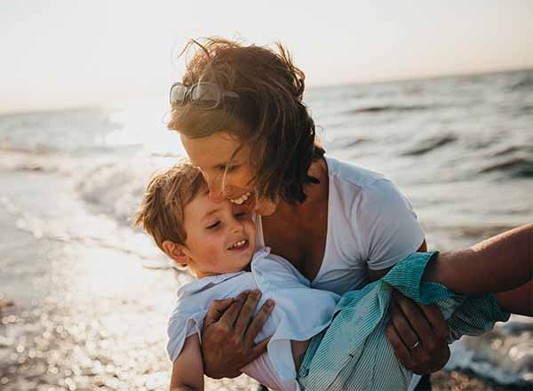 mum and son on the beach