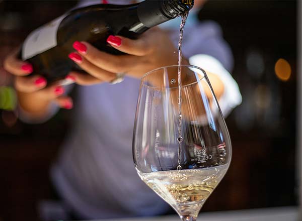 A tasting wine being poured