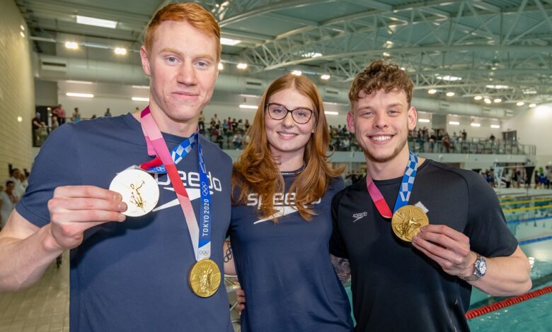 Olympic gold medal winners surprise young swimmers ahead of races
