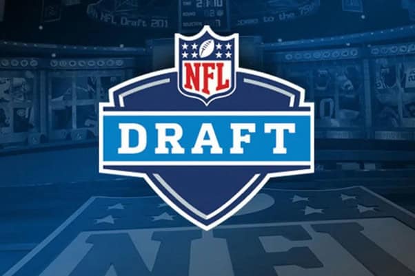 Official NFL Draft logo displayed on a sports arena background, highlighting the importance of draft picks in building successful NFL teams.