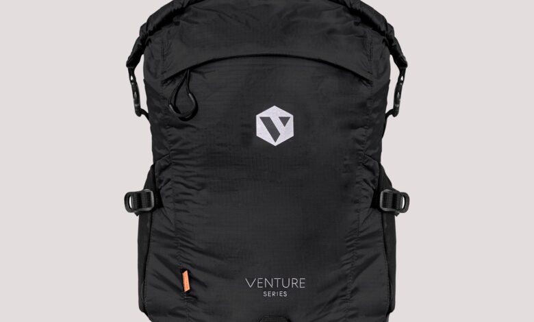 Lightweight black sports and travel backpack with multiple compartments, adjustable straps, and durable material for hiking, gym, and outdoor activities. Features a modern design with ample storage space.