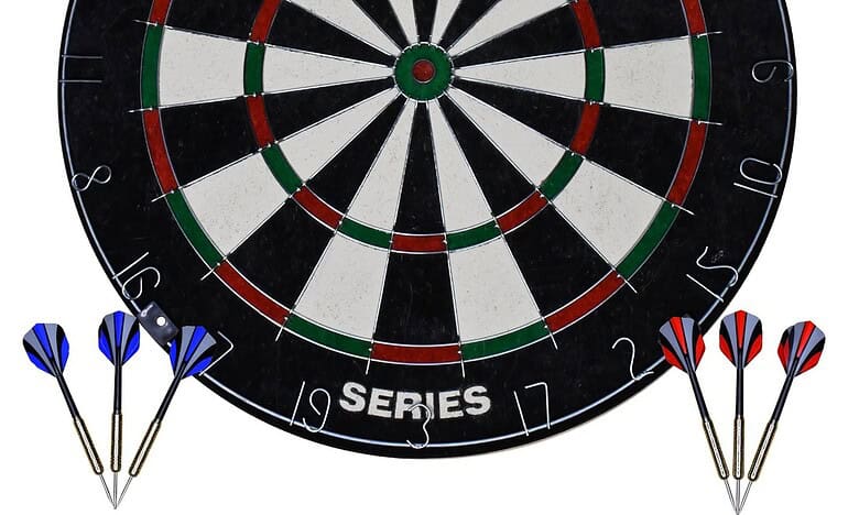 A dartboard with darts, used for professional pub and indoor sports games, promoting dart sports and betting tips from Sports Insight.