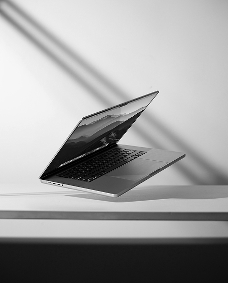 A Laptop hovering over a desk