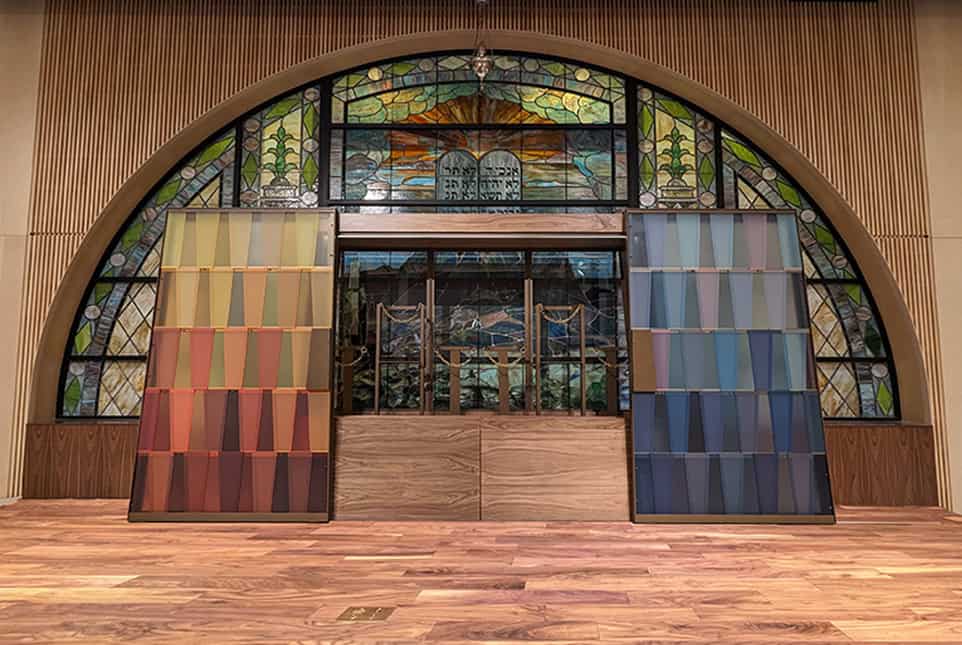 Colorful stained glass and fabric samples for architectural signs and fabrication.