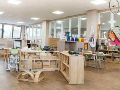 Bright and spacious early years classroom at Thrive Childcare, featuring engaging play areas, educational toys, and natural light to support children's development and learning.